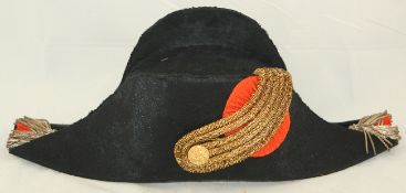 A 19th century French naval officers bi-corn hat, 17in. wide, with a pair of epaulettes, both with