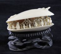 A Japanese ivory model of the `Clam`s Dream`, early 20th century, the interior carved in openwork