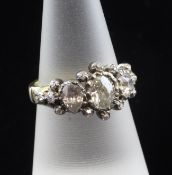An early 20th century gold and diamond cluster ring, set with oval, old mine and rose cut