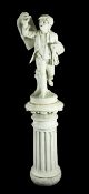 A late 19th / early 20th century Italian white marble figure of a young newspaper seller,