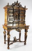 A 19th century Italian Renaissance revival carved walnut cabinet on stand, with a central cupboard