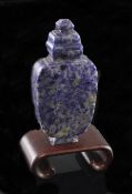 A Chinese lapis lazuli snuff bottle and stopper, 1850-1930, of flattened ovoid form, with