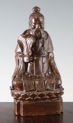 A Chinese Dehua cafe-au-lait glazed seated figure of Zhongli Quan, 19th century, the figure