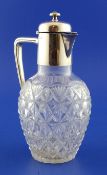 A late Victorian silver mounted cut glass claret jug, of baluster form, with angular handle and