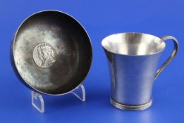 A 1930`s Arts and Crafts silver christening mug and bowl by Henry George Murphy, the mug with flared