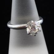 A platinum and solitaire diamond ring, the old round cut diamond weighing 1.58ct, size N.