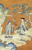 A Chinese Kesi panel, 19th century, depicting two immortals in a landscape with rockwork and a