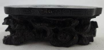 A Chinese Zitan wood stand, 19th century, the frieze inlaid in silver wire with scrolls, carved in