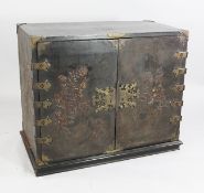 A Queen Anne black japanned cabinet, decorated all over with typical chinoiserie scenes, the pair of
