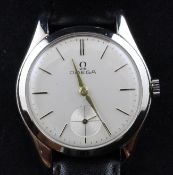 A gentleman`s 1950`s stainless steel Omega manual wind wrist watch, with baton numerals and