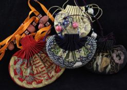 Four Chinese embroidered satin purses (hebao), 19th century, three with metal thread decoration on a