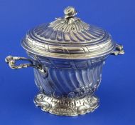 A George III silver two handled sugar bowl and cover, of wrythen form, with rose finial and