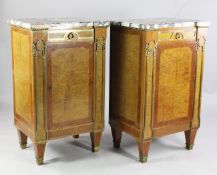 A pair of Louis XVI style ormolu mounted marble top side cabinets, each with single drawer and