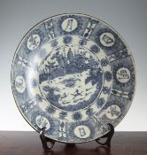 A large Chinese Ming blue and white dish, Swatow, mid 17th century, the centre painted with a