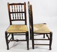A harlequin set of eight 18th / 19th century Derbyshire spindle back rush seated dining chairs, in
