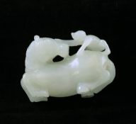 A Chinese white jade group of a recumbent horse and a monkey, 18th century, the stone with some