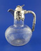 An early 20th century German 800 standard silver mounted cut glass claret jug, of ovoid form, with