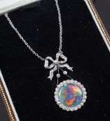 An Edwardian platinum, harlequin black opal and diamond drop pendant, with diamond set ribbon bale