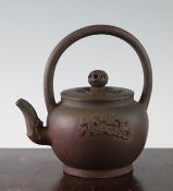 A Chinese Yixing pottery globular teapot and cover, Qing dynasty, the body decorated with chi-dragon