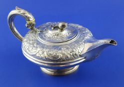 A William IV silver teapot by Charles Thomas Fox, of squat circular form, with engraved monogram and
