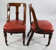 A set of twelve late Victorian mahogany dining chairs, with shaped backs and central spar with
