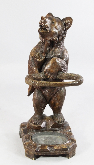 A late 19th / early 20th century carved Black Forest bear stick stand, modelled as a standing bear