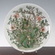 A Chinese famille verte dish, Kangxi period, painted to the centre with a pheasant amid rockwork,