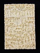 A Chinese export ivory card case, 19th century, of rectangular form, carved in high relief with