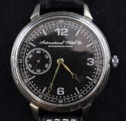 An early 20th century stainless steel IWC pocket watch, now presented as a wrist watch, the black