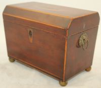 A 19th century mahogany tea caddy, top with shell marquetry inlay on ball feet, 7.5in.