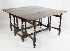 A Charles II oak gateleg table, with squared drop leaves and barley twist underframe, extends to 4ft