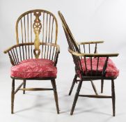 A pair of Windsor wheelback armchairs, each with elm seats and H frame stretchers