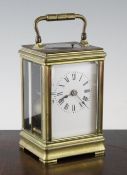 A late 19th century French brass hour repeating carriage clock in gorge case with enamelled Roman