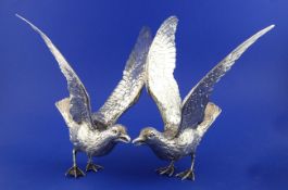 A pair of early 20th century? sterling silver free-standing model seagulls, with outstretched