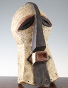 A carved and painted African mask, Songe, Democratic Republic of Congo, decorated all over with