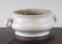 A Chinese Dehua blanc-de-chine censer, 17th / 18th century, of squat baluster form with a pair of