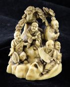 A Japanese ivory okimono group of five rakan, early 20th century, each seated on a rockwork base