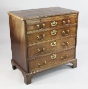 A George III mahogany chest, of four long graduated drawers with brushing slide above, on bracket