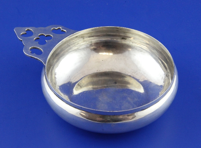 A 1930`s 18th century style silver bleeding bowl by Goldsmiths & Silversmiths Co Ltd, with pierced