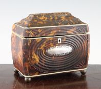 A Regency tortoiseshell two division tea caddy, the front with central oval initial plaque, press