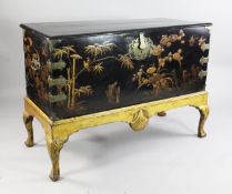 A George I black japanned and gilt coffer on stand, decorated with flowers, birds and figures with