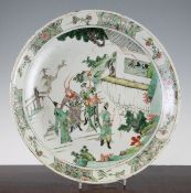 A Chinese famille verte dish, Kangxi period, depicting a scholar sleeping at his table and