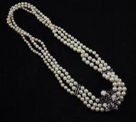 A triple strand graduated cultured pearl choker necklace with white gold, sapphire and diamond