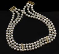 A 20th century Italian triple strand cultured pearl choker necklace with diamond set clasp, and