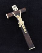 A 19th century Continental horn and bone crucifix reliquary, the sliding back revealing labels