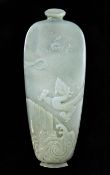 A Chinese celadon jade applique, 19th century, in the form of a vase carved in relief with a