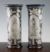 A pair of Doulton Lambeth sgraffito cylindrical vases, by Mary Mitchell, dated 1880, each