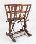 An early Victorian mahogany folio stand, with ratchet sides, vase shaped panel end supports and