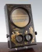 An early 20th century folding chinoiserie black lacquer stereoscopic card viewer, decorated with