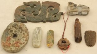 A group of eight Chinese archaistic stone carvings, to include a chi-dragon plaque, an oval chi-